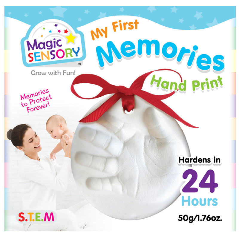 Load image into Gallery viewer, Close-up of the finished clay handprint keepsake with red ribbon bow against the kit box
