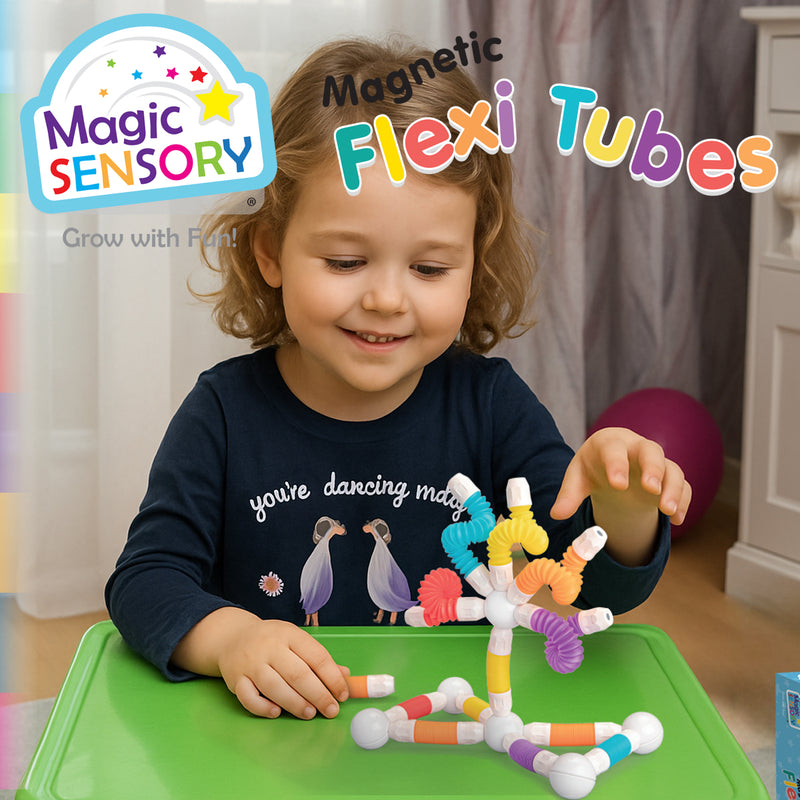 Load image into Gallery viewer, Smiling child building a colourful tube structure on a table
