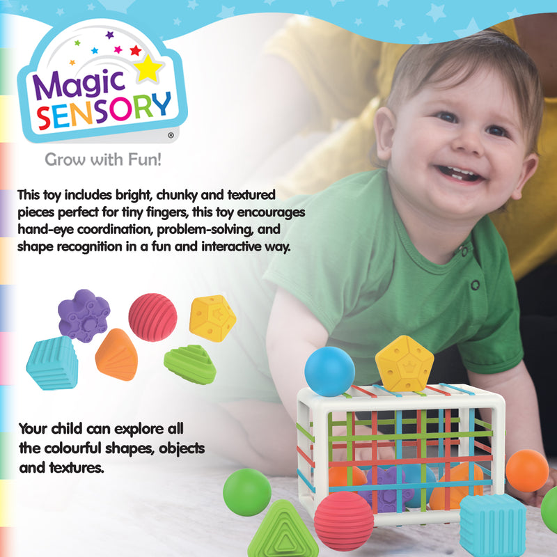 Load image into Gallery viewer, Smiling baby playing with the Shape Sorting Bin and its colourful pieces
