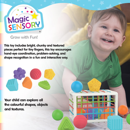 Smiling baby playing with the Shape Sorting Bin and its colourful pieces