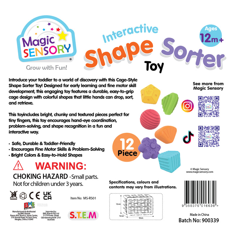 Load image into Gallery viewer, Toddler girl smiling beside the Shape Sorting Bin with its colourful pieces
